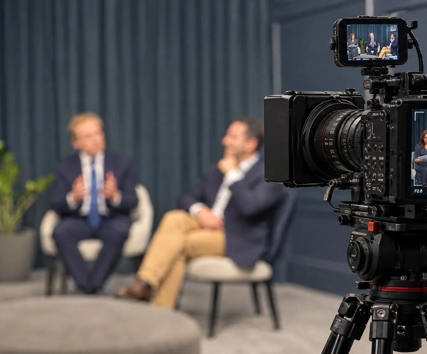 Simon and Richard speaking on the webinar, with a video camera in the foreground